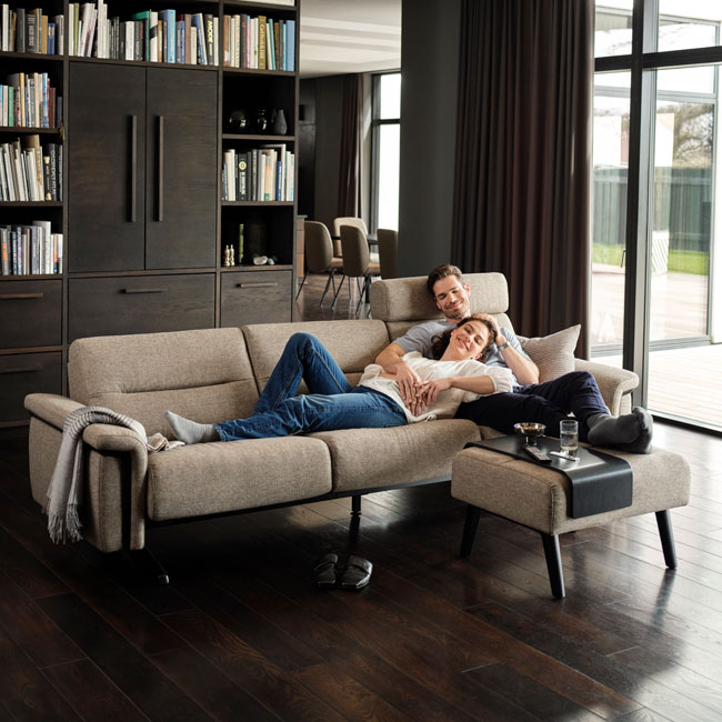Couple relaxing in Stressless Stella sofa